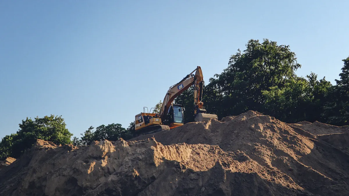 Tracked excavator working on top of an earth embankment during pond construction